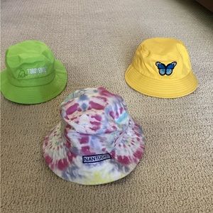 Three adorable bucket hats. Nantucket, Toro Verde Puerto Rico and Butterfly